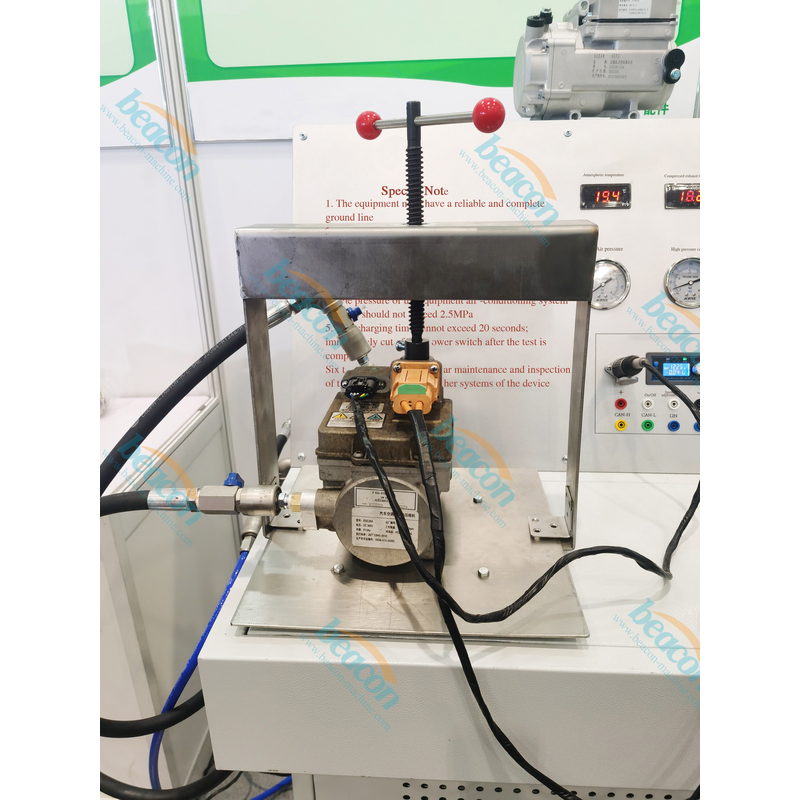 NC101 test platen with an electric air conditioning compressor clamped and connected for testing